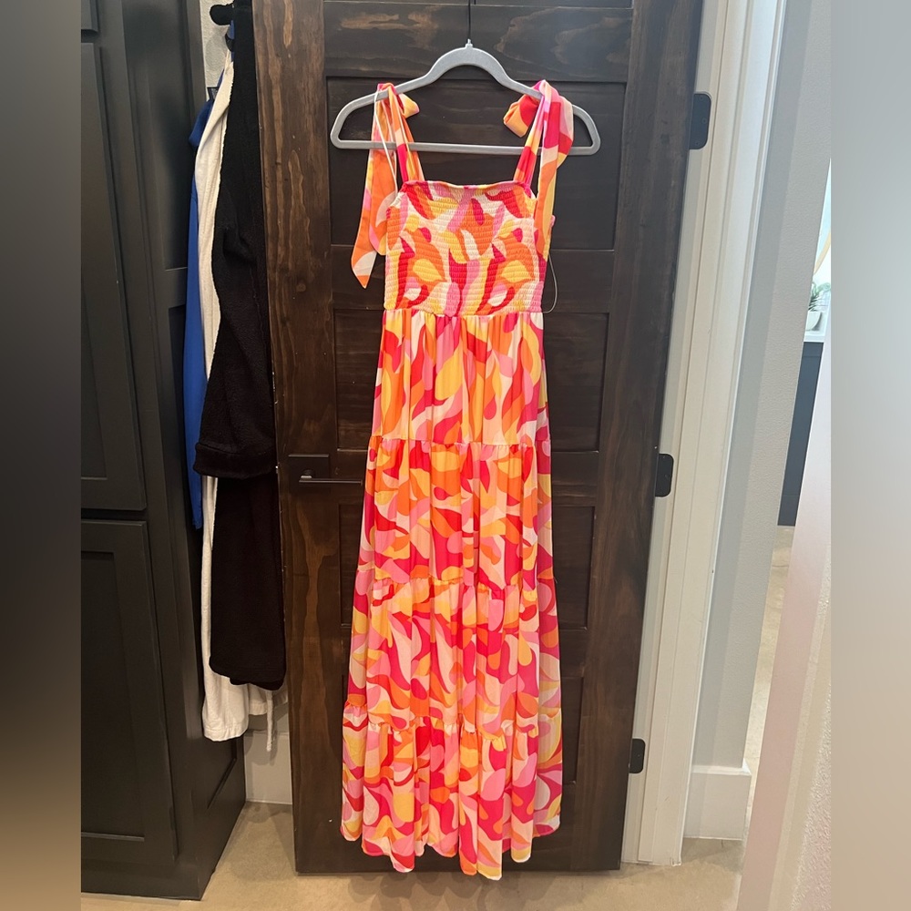 Super fun tiered, colorful, smocked dress with shoulder ties